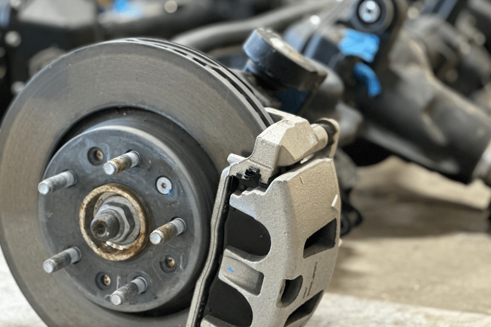 Front disc brake conversion installed on a classic Chevy replacing factory drum brakes