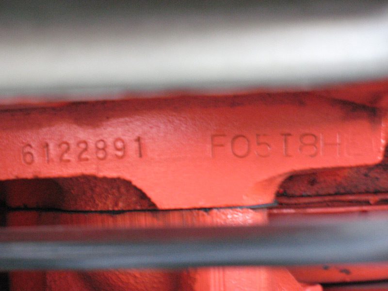 Small-block Chevy engine suffix code stamping on front engine pad